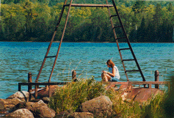 Amber writing in journal at dock